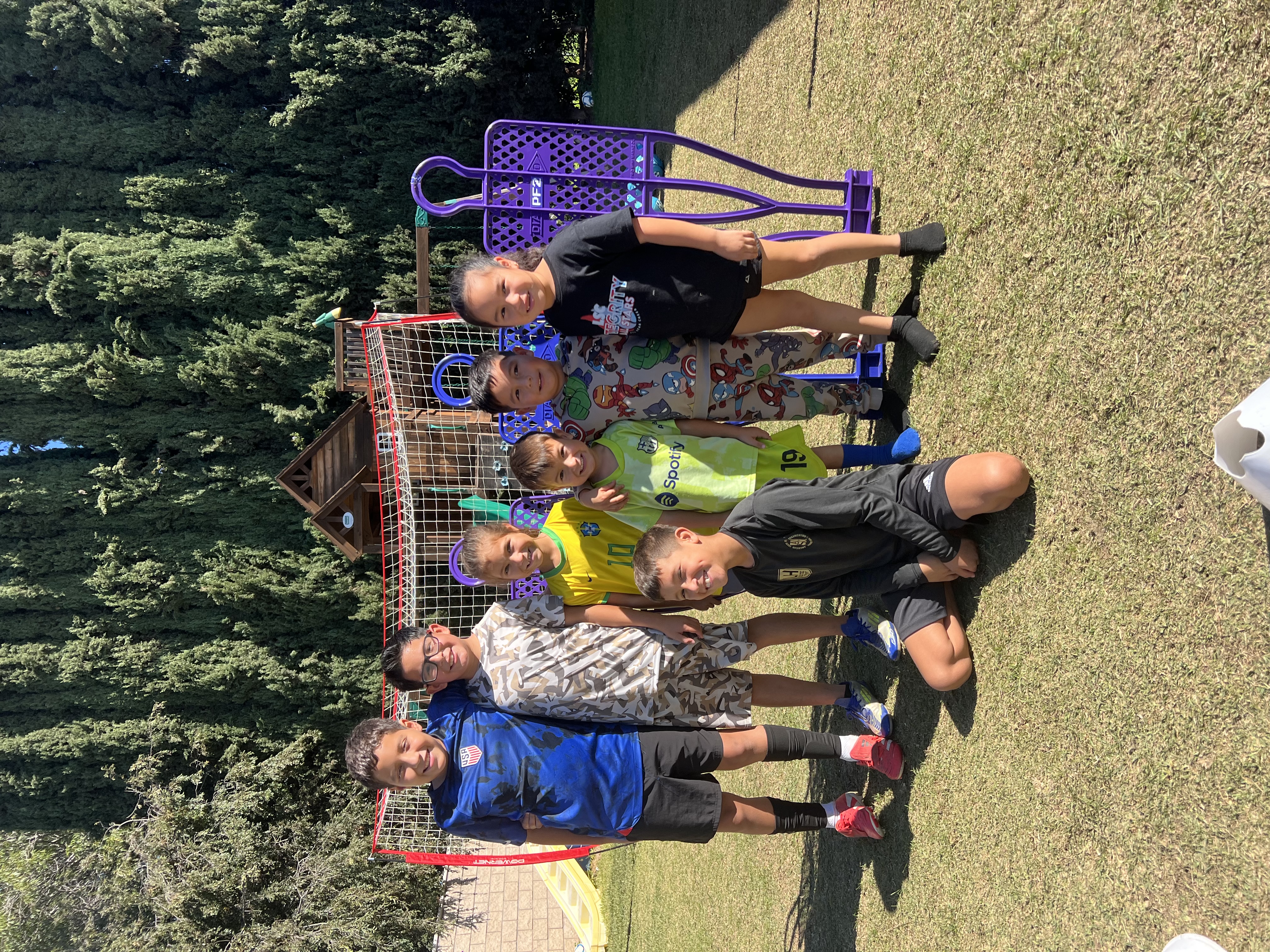 Group of young players smiling together after a session